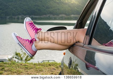 Legs Out Of The Car Window By The Lake