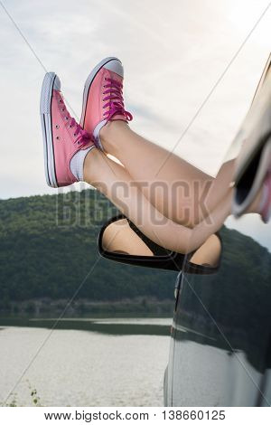 Legs Out Of The Car Window By The Lake