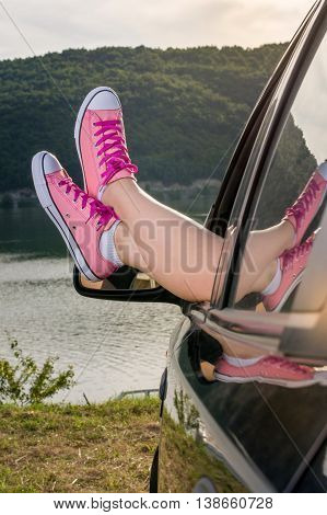Legs Out Of The Car Window By The Lake
