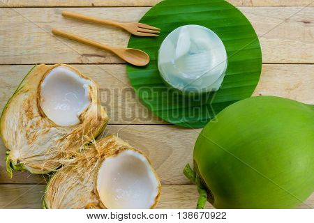 coconut jelly and wooden spoon on wooden background