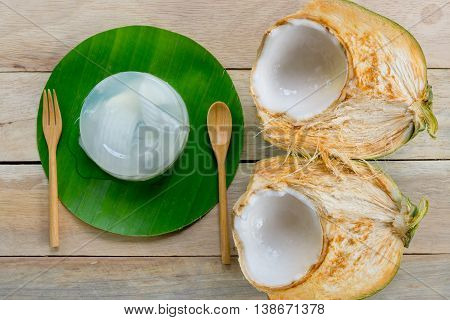 coconut jelly and wooden spoon on wooden background