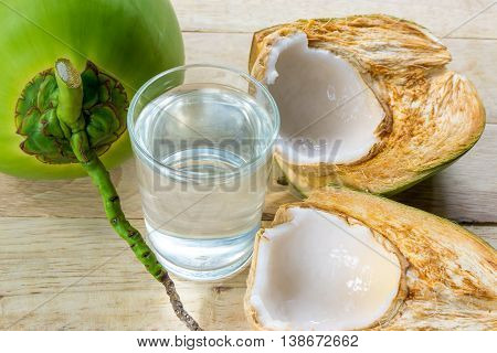 water coconut on wooden background for good health