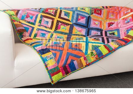 Patchwork quilt. Part of patchwork quilt as background. Flower print. Color blanket in style patchwork. Color blanket. Handmade.