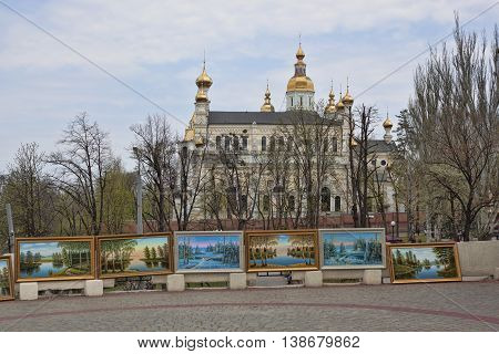 KHARKIV UKRAINE - APRIL 26 2015: Improvised exhibition of works by an unknown artist near the Pokrovsky monastery in Kharkiv permanent vernissage of street artists
