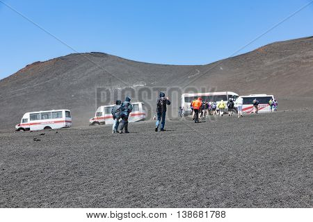 MOUNT ETNA ITALY - MAY 23: Landrovers ands tourists visiting the vulcano of Mount Etna on May 23 2016 at the island Sicily Italy