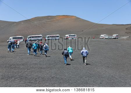 MOUNT ETNA ITALY - MAY 23: Landrovers ands tourists visiting the vulcano of Mount Etna on May 23 2016 at the island Sicily Italy