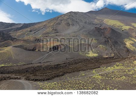 Mount Etna with several craters and solidified lava flows at Sicily Italy