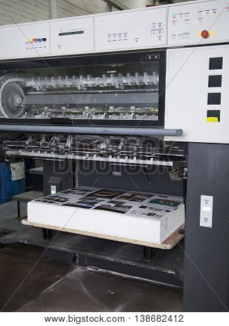 Close up of an offset printing machine during production