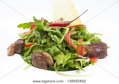 duck with arugula on a white background in the restaurant