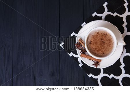 Home-made cocoa with cinnamon on the black