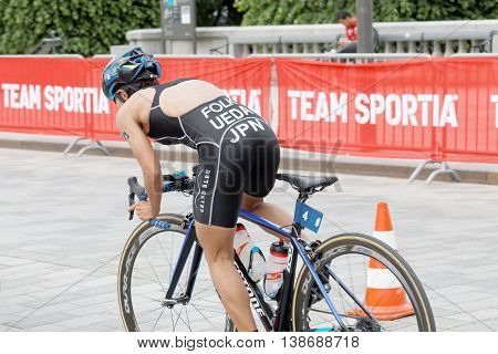 STOCKHOLM - JUL 02 2016: Rear view of female triathlete cyclist Ai Ueda Japan in the Women's ITU World Triathlon series event July 02 2016 in Stockholm Sweden