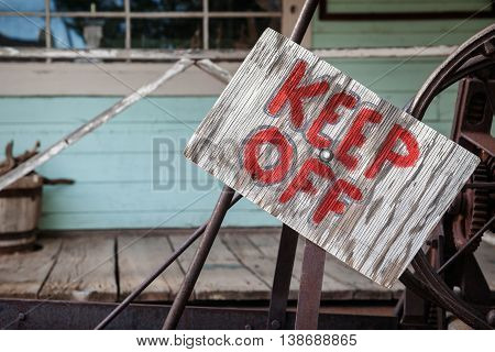 Keep Out Sign on wooden plate horizontal composition