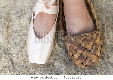 Feet girl in Ballet shoes and Bast shoe on canvas