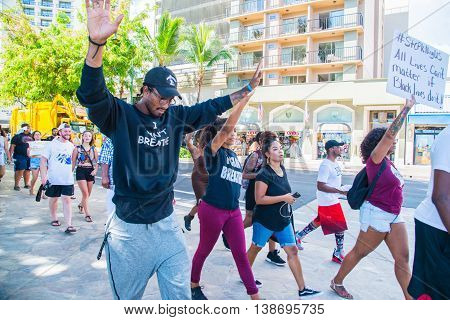 Honolulu, HI. USA  July 9, 2016  Approximately fifty or so Black Lives Matter protesters hit the strip in Waikiki on Saturday afternoon with chants of 