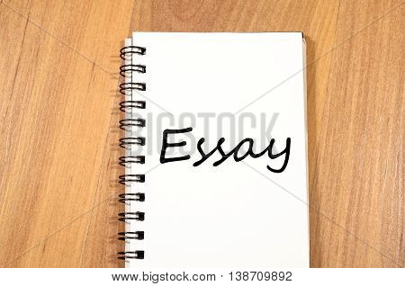 Essay text concept write on notebook .
