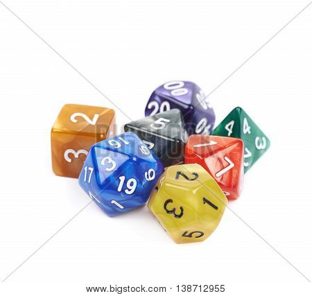 Pile of colorful roleplaying polyhedral dices isolated over the white background