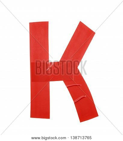 Letter K symbol made of insulating tape pieces, isolated over the white background