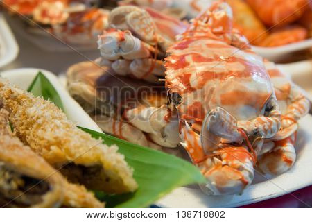 Freshly boiled crabs on sale at a local market Samut Songkhram Thailand. Travel cuisine abstract.