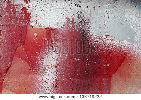Cracked And Scratched Red And White Paint On Grunge Metal