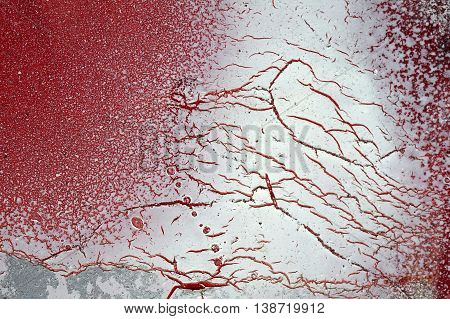 Cracked And Scratched Red And White Paint On Grunge Metal