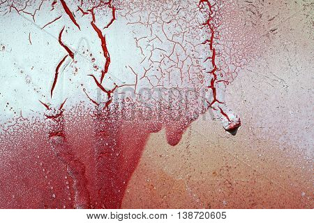 Cracked And Dripping Red And White Paint On Grunge Metal