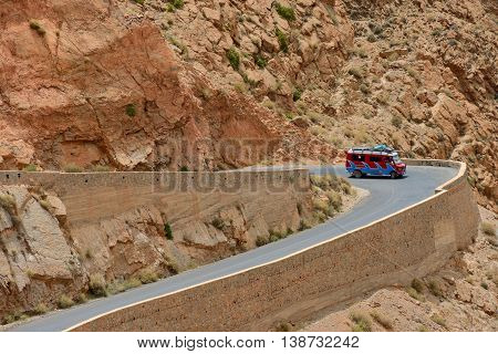 DADES GORGES, MOROCCO - JULY 11: Car on a winding road, July 11, 2013 in Dades Gorges, Morocco. Road in Dades Gorges very popular tourist route in east Morocco.