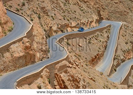 DADES GORGES, MOROCCO - JULY 11: car on a winding road, July 11, 2013 in Dades Gorges, Morocco. Road in Dades Gorges very popular tourist route in east Morocco.