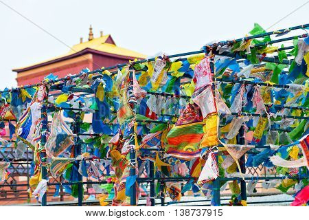 Prayer flags and Hadak at sunset in the Republic of Buryatia. Datsan Rinpoche Bagsha on Bald Mountain in Ulan-Ude, Russia.