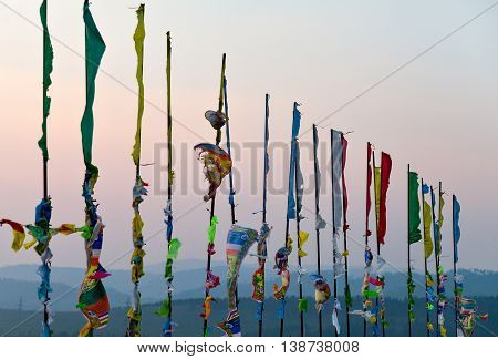 Prayer flags and Hadak at sunset in the Republic of Buryatia. Datsan Rinpoche Bagsha on Bald Mountain in Ulan-Ude, Russia.