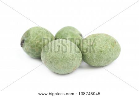 Green wasabi coated peanuts isolated over the white background
