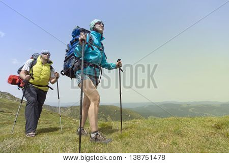 Hiking in the mountains in the summer on a sunny day.