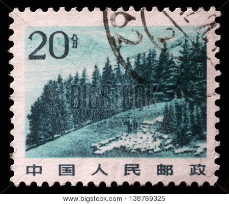 ZAGREB, CROATIA - SEPTEMBER 08: A stamp printed in China shows image of Chinese highland with pine trees in Tianshan Mountain, circa 1983, on September 08, 2012, Zagreb, Croatia