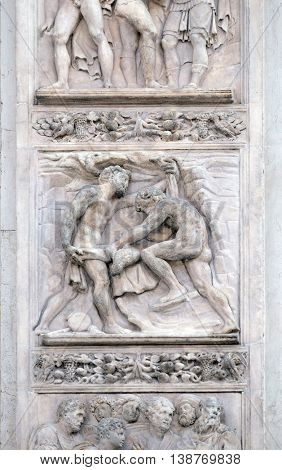 BOLOGNA, ITALY - JUNE 04: The brothers tinged Joseph's coat with the blood by Giacomo Raibolini, right door of San Petronio Basilica in Bologna, Italy, on June 04, 2015