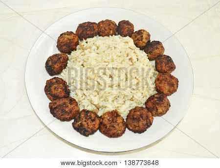 traditional greek rice pilaff with baked meatballs