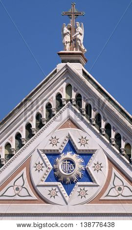 FLORENCE, ITALY - JUNE 05: IHS sign, Basilica di Santa Croce (Basilica of the Holy Cross) - famous Franciscan church in Florence, Italy, on June 05, 2015