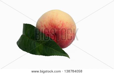 Azerbaijani peach with a green leaf on a white background. isolated photo