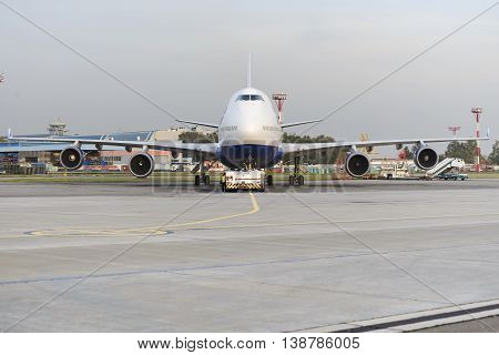 MOSCOW, RUSSIA - SEPTEMBER 26, 2014: Boeing 747 Transaero towed to the runway. Transaero Airlines has ceased to exist in 2015.