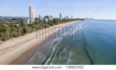 Aerial view of Burleigh beach and Miami Headland in the horizon, at sunrise. Gold Coast, Australia