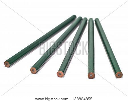 five unsharpened green pencils isolated on white background