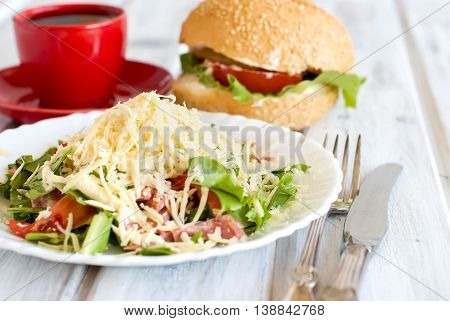 Salad, A Burger And A Cup Of Coffee For Breakfast
