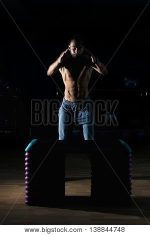 Athlete Gave Exercise. Jumping On The Box. Phase Touchdown.