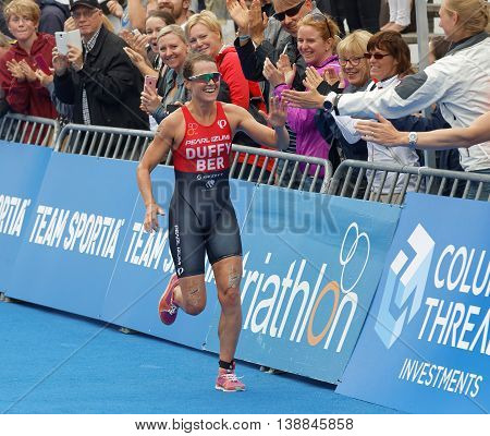 STOCKHOLM - JUL 02 2016: Winning triathlete Flora Duffy (BER) running at the finish in the Women's ITU World Triathlon series event July 02 2016 in Stockholm Sweden