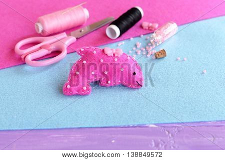 Cute pink felt Dolphin embellished with beads and button. Stuffed sea animal toy. Creative felt marine creature crafts for kids. Sewing materials and supplies