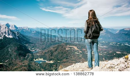 Woman standing in alp mountains peak, Karwendelspitze