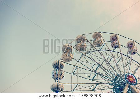 ferris wheel against blue sky vintage filter effects