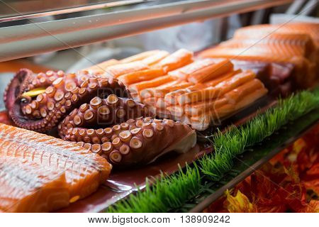 Food and Japanese food sashimi in glass box
