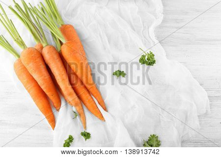 Fresh carrots on a cheesecloth