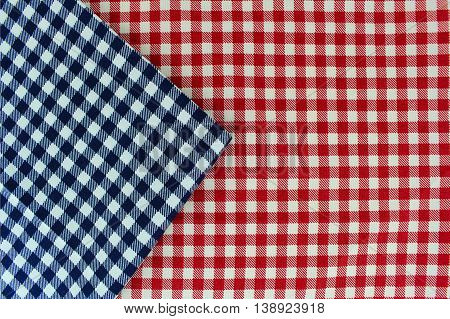 Wooden table covered with tablecloth. View from top. Empty tablecloth for product montage. Free space for products and for your text