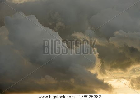 Background Of Golden Storm Clouds At Sunset.