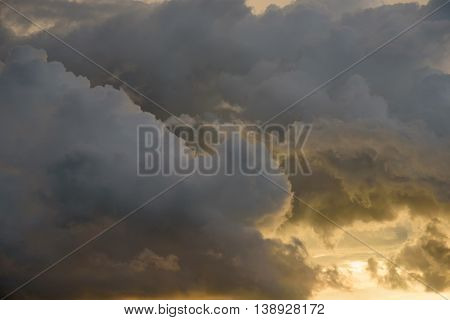 Background Of Golden Storm Clouds At Sunset.